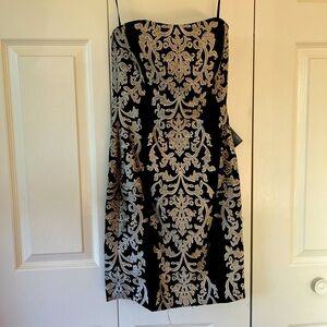 White House black market cocktail/homecoming dress. Tags on. Never worn. Size 00
